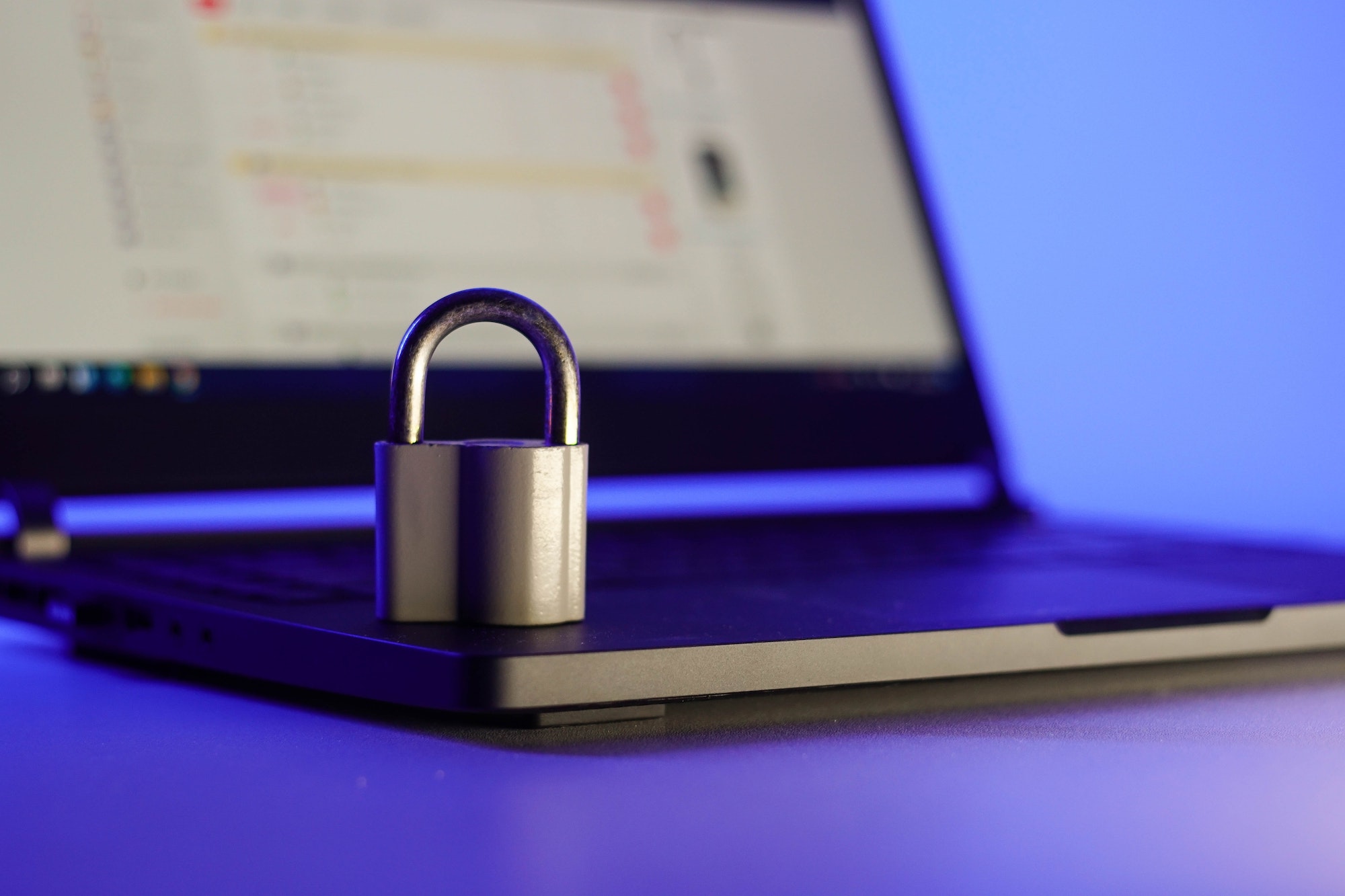 locked-metal-padlock-on-a-laptop-keyboard-over-blue-background-cyber-security-concept-.jpg